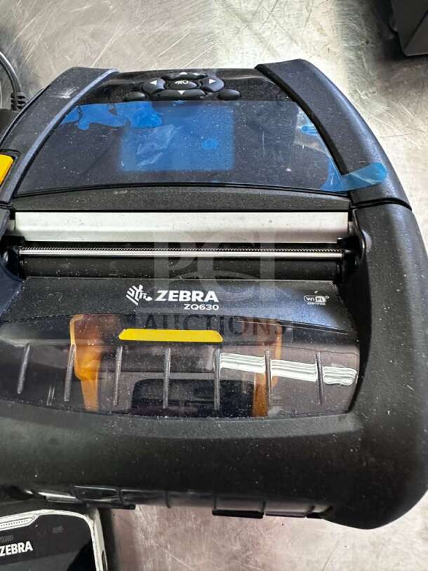 Zebra ZQ630 mobile thermal label printer, elite condition, WiFi enabled, clear screen, full operational status, label visible.