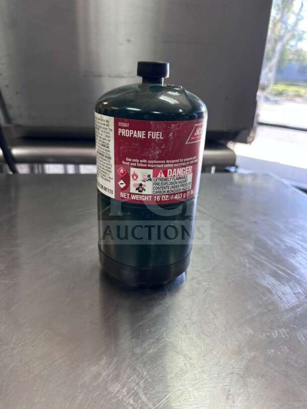 Ace Hardware 16 oz steel propane fuel cylinder in exceptional condition. Label shows model ACE-S-PROP-1007, ready for use.