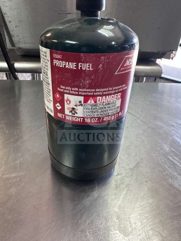 Ace Hardware 16 oz steel propane fuel cylinder, exceptional condition, for camping and heating. Includes safety instructions.