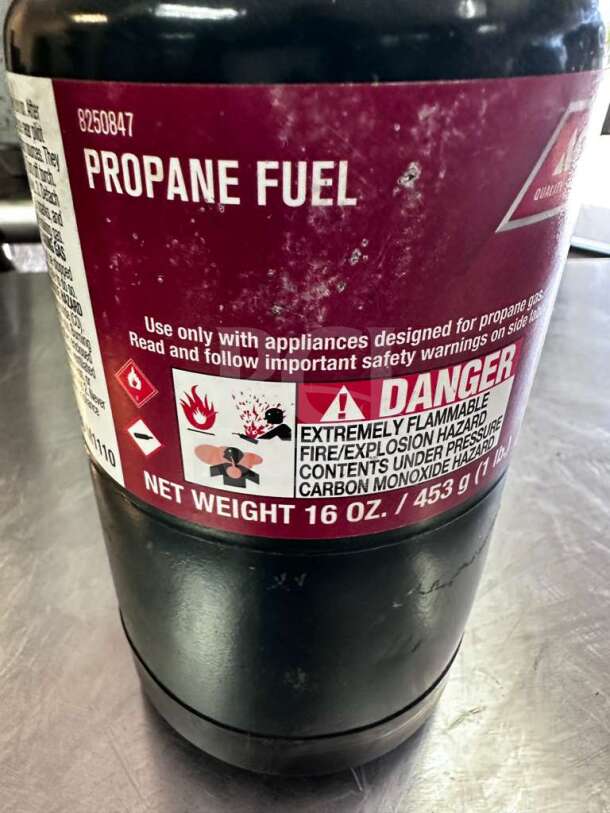 Ace Hardware 16 oz steel propane fuel cylinder in exceptional condition, ready for camping and heating use.