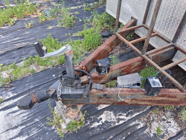 Rusty hitch of 2020 Diamond Cargo 24' Custom Mobile Kitchen trailer with visible wiring and wear, VIN 53NBE2429L1076062.