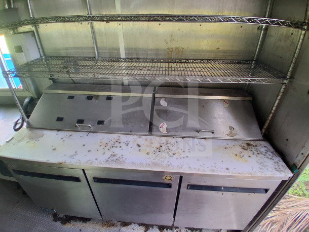 2020 Diamond Cargo 24' Custom Mobile Kitchen interior, featuring stainless steel prep area, shelving, and storage.