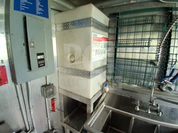 2020 Diamond Cargo 24' mobile kitchen interior, featuring stainless steel sink and storage racks. Visible equipment labels.