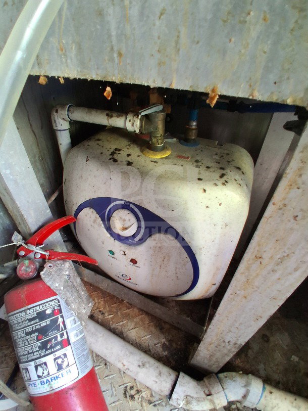 2020 Diamond Cargo 24' mobile kitchen interior, showing a fire extinguisher and pipe connections. Visible wear and use.