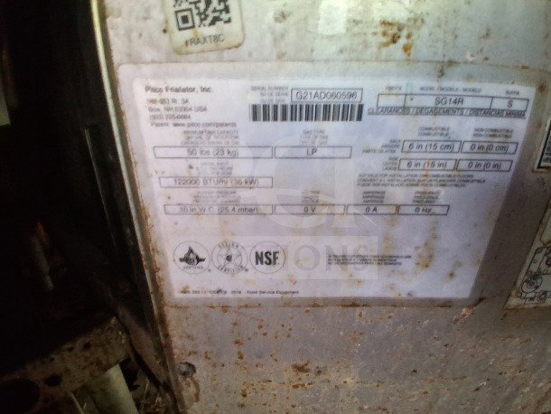 Label on Pitco fryer indicating model SG14R, 122,000 BTU, NSF certified. Rust visible on metal surface.