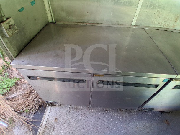 2020 Diamond Cargo 24' mobile kitchen interior, showing stainless steel refrigeration units with visible wear.