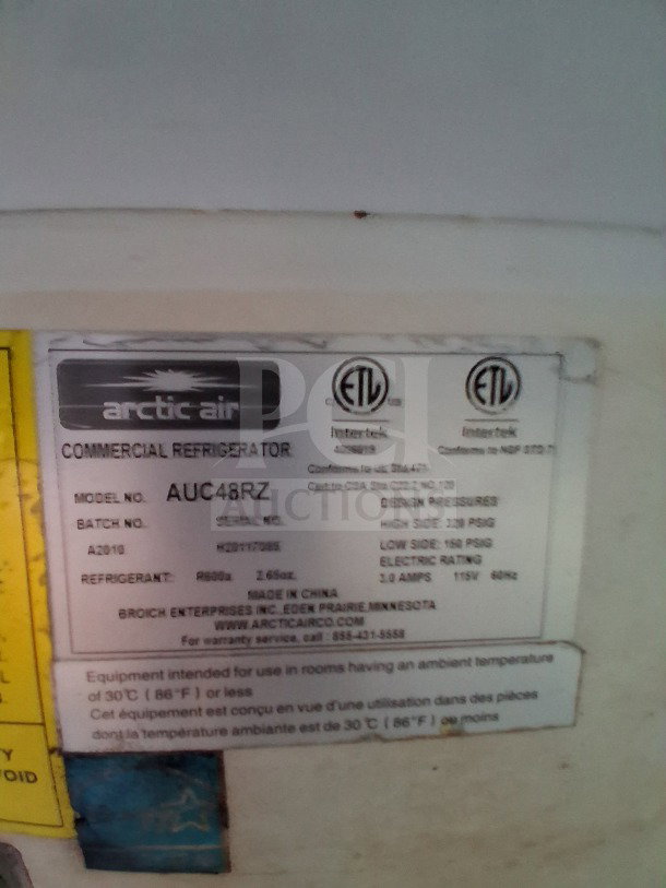 Arctic Air commercial refrigerator label, model AUC48RZ. Details include refrigerant type and electrical rating.