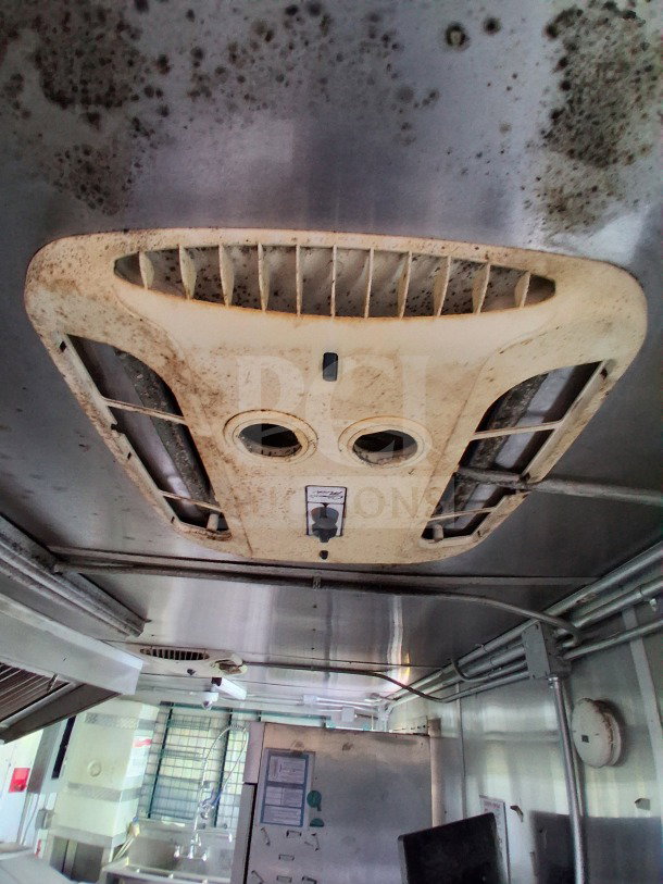 2020 Diamond Cargo 24' Custom Mobile Kitchen interior. Features stainless steel setup with visible ventilation system.