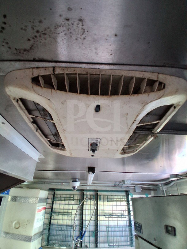 Interior of 2020 Diamond Cargo 24' Custom Mobile Kitchen showing stainless steel setup, ventilation system, and equipment.