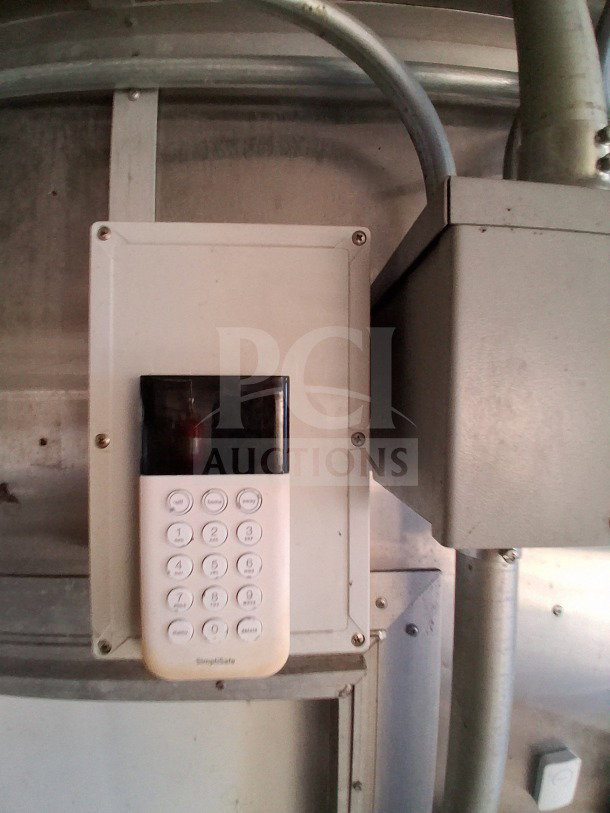 Control panel with keypad for security system in Diamond Cargo 24' Mobile Kitchen. Provides secure access to interior.