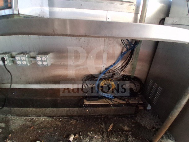Interior view of 2020 Diamond Cargo 24' Mobile Kitchen. Shows under-counter wiring and multiple electrical outlets.