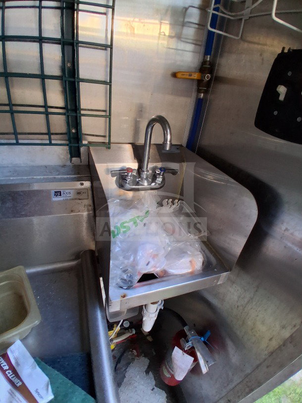 2020 Diamond Cargo 24' Mobile Kitchen sink area with stainless steel interior, faucet, and visible fire extinguisher.