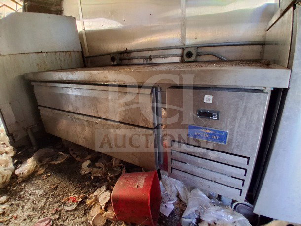 2020 Diamond Cargo 24' mobile kitchen interior, showing unused Arctic Air refrigeration and stainless steel cookline.