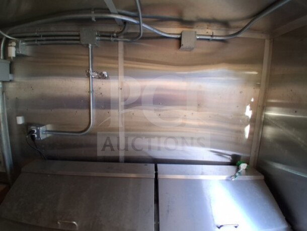 2020 Diamond Cargo 24' Custom Mobile Kitchen interior, featuring stainless steel walls and visible electrical wiring.