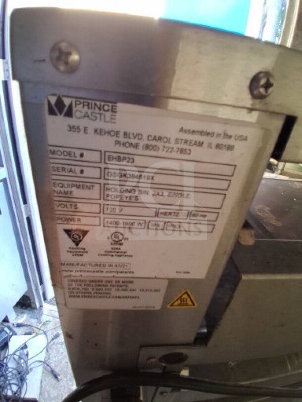 Prince Castle equipment label showing model EHBP23, serial GSGK384819X, 120V, 1400-1860W. Assembled in USA.