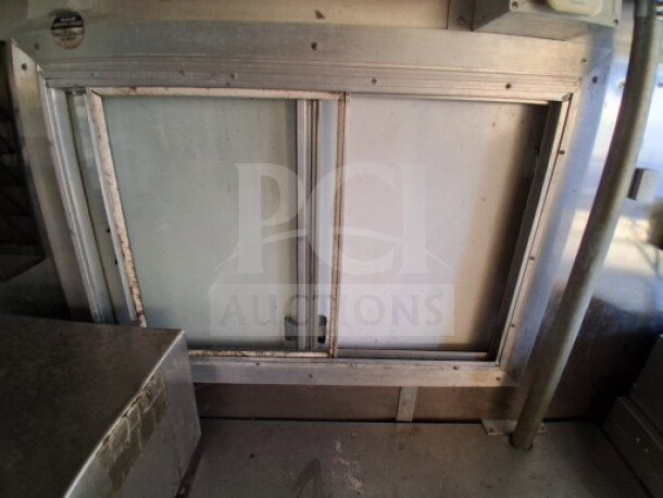 2020 Diamond Cargo 24' Custom Mobile Kitchen interior, showing stainless steel surfaces and equipment setup.