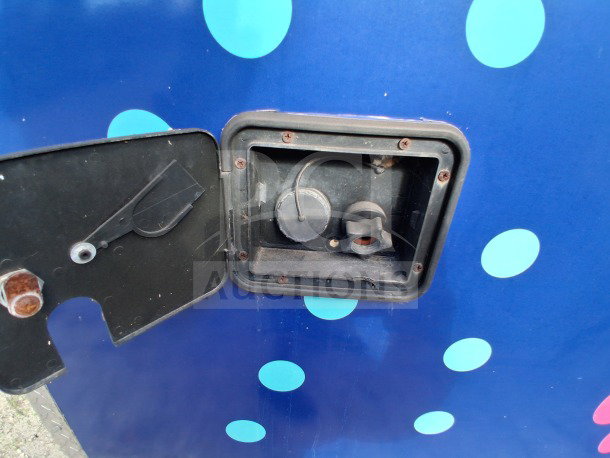 2019 D&A Custom Mobile Kitchen with dark blue wrap detailing external utility connections.