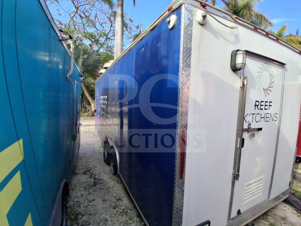 2019 D&A Custom 24FT mobile kitchen trailer with dark blue wrap, "REEF KITCHENS" branding. Features high-volume service setup.