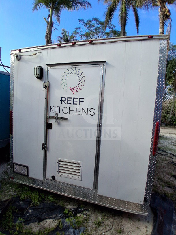 2019 D&A Custom 24FT mobile kitchen trailer with dark blue wrap, featuring refrigeration suite and double Avantco fryers.