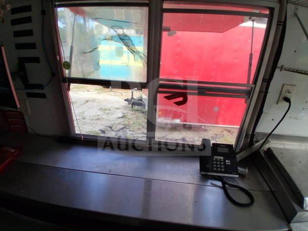 Interior view of a 2019 D&A Custom Mobile Kitchen Food Trailer, showcasing the workspace and equipment.