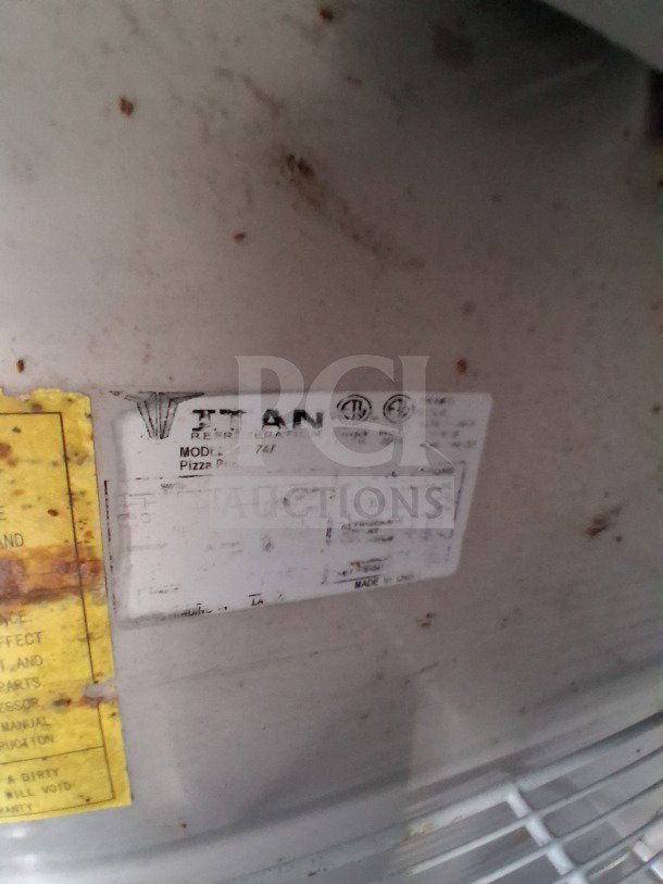 D&A Custom 24FT food trailer detail showing manufacturer's label; includes model and serial information.