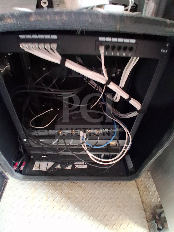 Network cables and equipment inside the 2019 D&A Custom 24FT mobile kitchen trailer, highlighting the organized wiring setup.