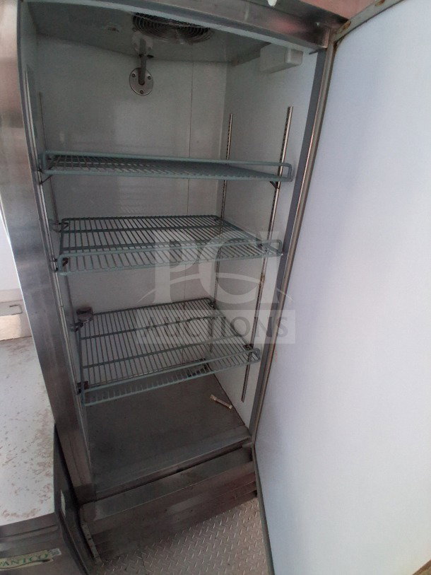 2019 D&A Custom 24ft mobile kitchen interior with open vertical freezer, featuring wire shelving, spacious interior. VIN: 1D9BE2427KF803015.