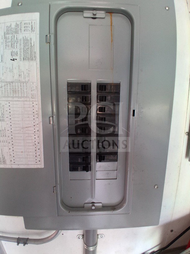 Electrical panel inside a 2019 D&A Custom 24FT mobile kitchen trailer. Includes breaker switches and wiring diagram.