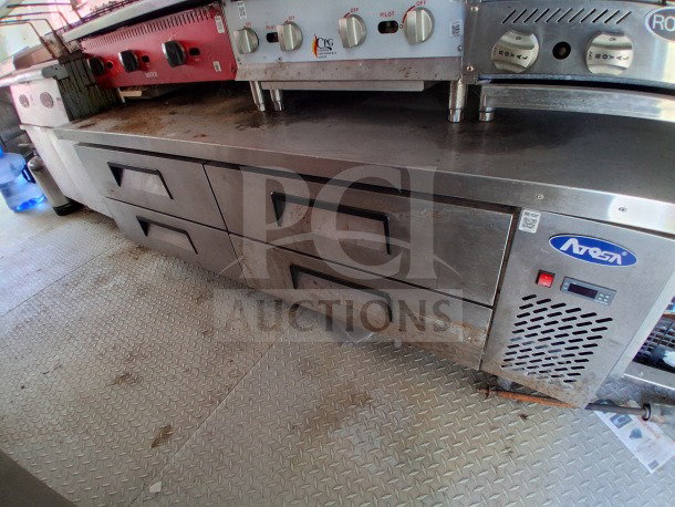 2019 D&A 24ft mobile kitchen, features Avantco fryers, prep tables, vertical freezer. Dark blue wrap, used condition.