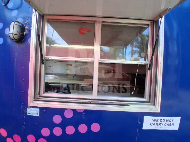 2019 D&A Custom mobile kitchen trailer, dark blue wrap, serving window, built-in equipment visible, "We Do Not Carry Cash" sign.