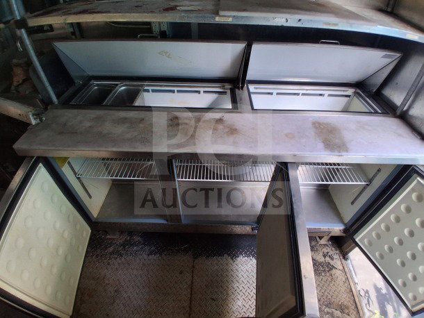 2019 Diamond Cargo 24' mobile kitchen interior with dual refrigeration units, stainless steel surfaces, and ventilation. Needs deep clean.
