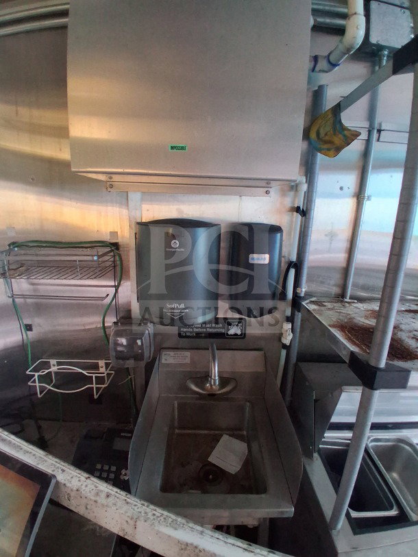 2019 Diamond Cargo 24' mobile kitchen interior showing sink area, paper towel dispensers, and ventilation. Needs deep cleaning.