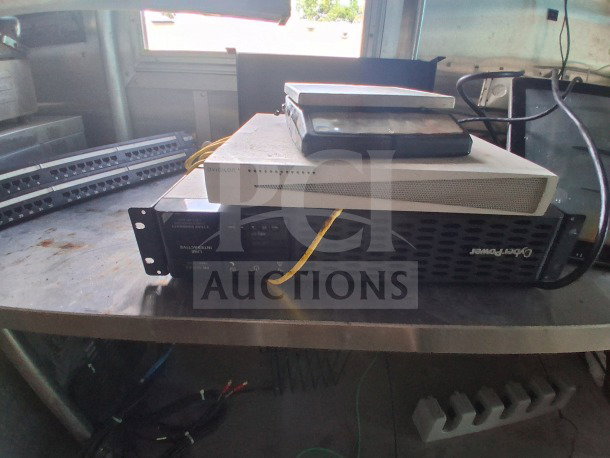 2019 Diamond Cargo 24' mobile kitchen interior, showing electronic equipment stacked on a metal counter. Needs deep cleaning.