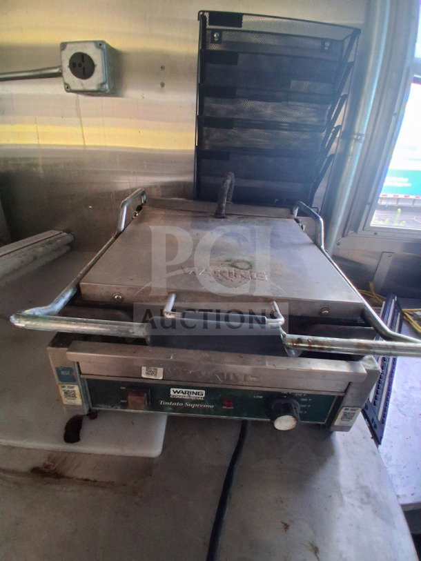 2019 Diamond Cargo 24' mobile kitchen interior showing high-quality Waring grill requiring deep clean.