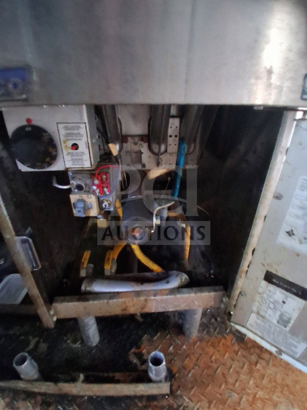 2019 Diamond Cargo 24' mobile kitchen interior, showing ventilation system and Frymaster equipment. Needs deep cleaning.