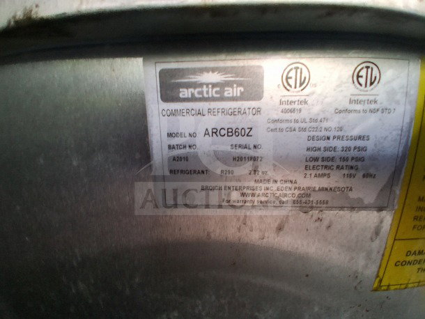 Label on Arctic Air commercial refrigerator model ARCB60Z shows specifications, including refrigerant type R290 and electric rating.