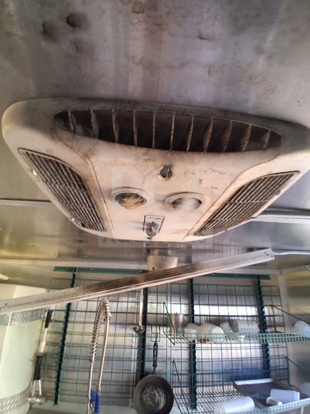 2019 Diamond Cargo 24' mobile kitchen interior showing ventilation unit needing cleaning, with cookware and storage racks.