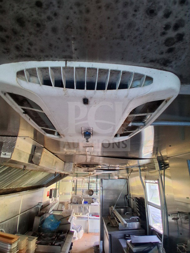 2019 Diamond Cargo 24' mobile kitchen interior, featuring Frymaster and Arctic Air equipment, needs deep cleaning.