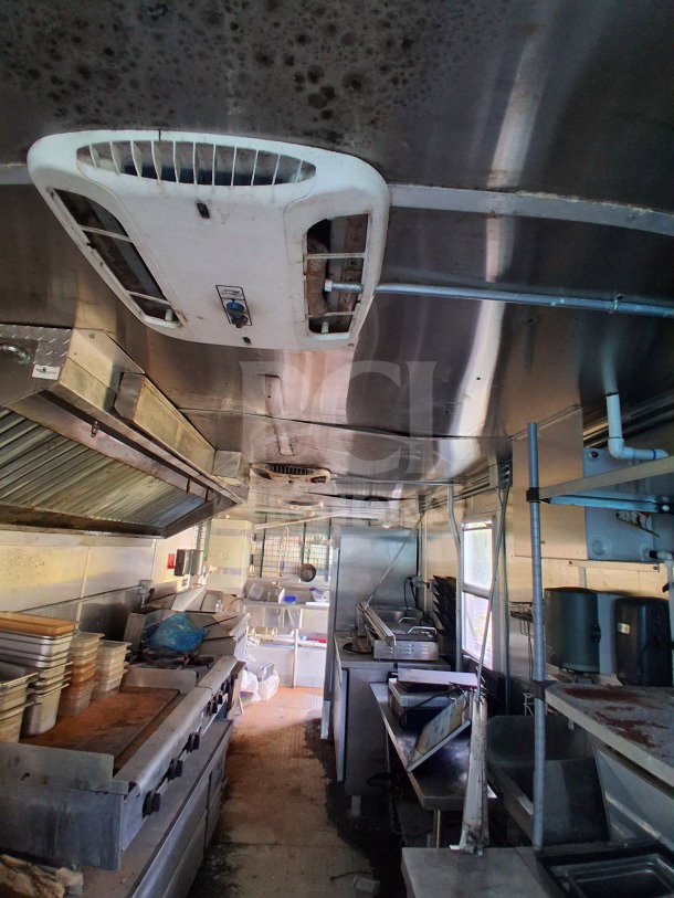 2019 Diamond Cargo 24' mobile kitchen trailer, features high-capacity Frymaster and Arctic Air equipment, needs deep cleaning.