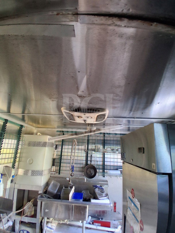 2019 Diamond Cargo 24' mobile kitchen interior. Features heavy-duty equipment, needs deep cleaning. Model: Kitchen on Wheels.