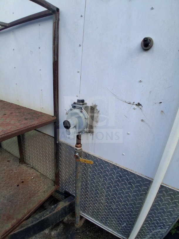 2019 Diamond Cargo 24' mobile kitchen exterior with utility connections, requiring deep clean. Solid frame, needs cleaning.