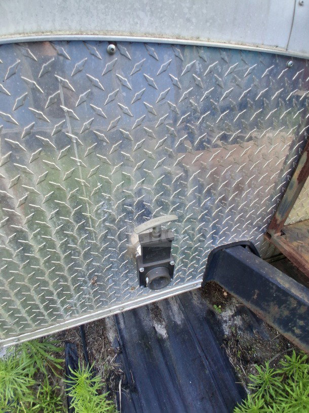 2019 Diamond Cargo mobile kitchen trailer hitch area; diamond plate metal with outlet; needs cleaning.