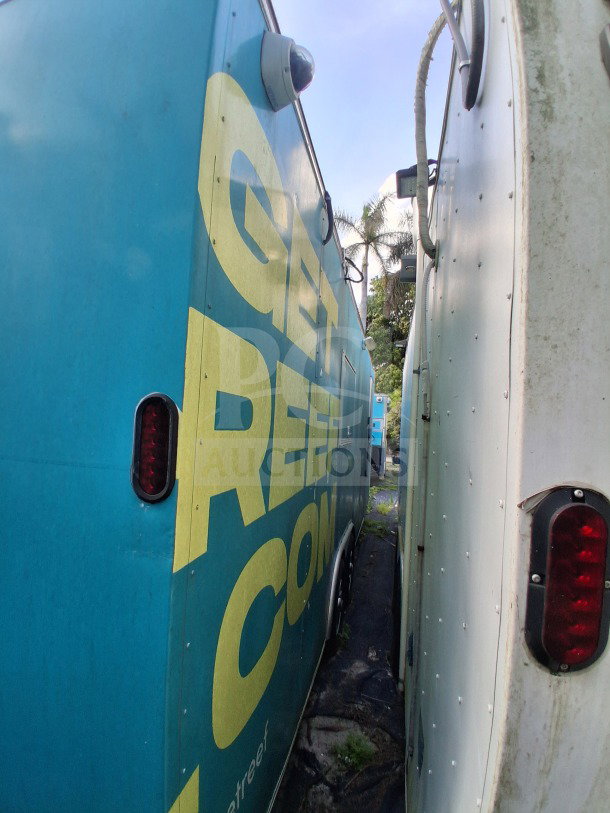2019 Diamond Cargo 24' mobile kitchen trailer; vibrant exterior, sturdy build; needs deep cleaning. VIN: 53NBE2424M1089707.