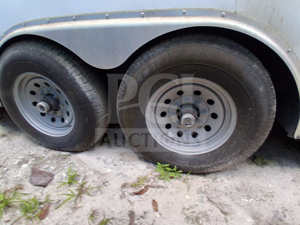 2019 Diamond Cargo mobile kitchen trailer wheels and tires, showing wear, part of a pro-series kitchen on wheels.