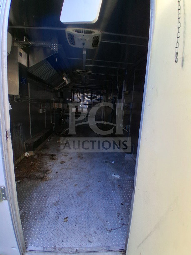 2019 Diamond Cargo 24' mobile kitchen interior. Features ventilation, sinks, electrical, gas lines. Needs deep clean.