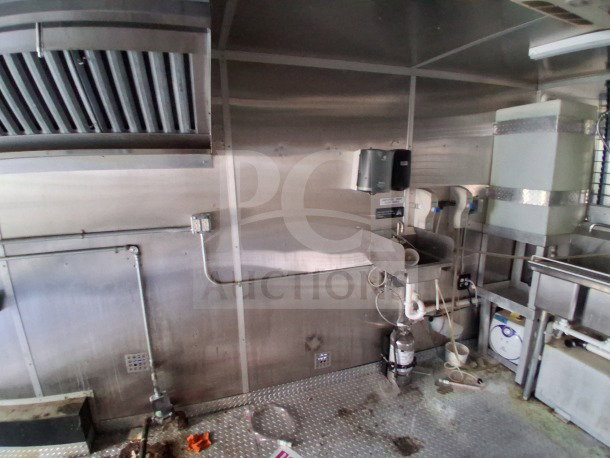 2019 Diamond Cargo 24' mobile kitchen interior, featuring ventilation, sinks, and gas lines. Needs deep cleaning.