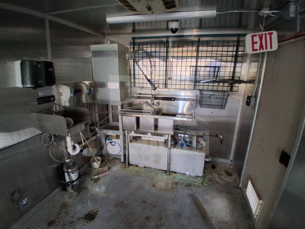 2019 Diamond Cargo 24' mobile kitchen interior, featuring sinks, ventilation, and plumbing. Requires deep cleaning.