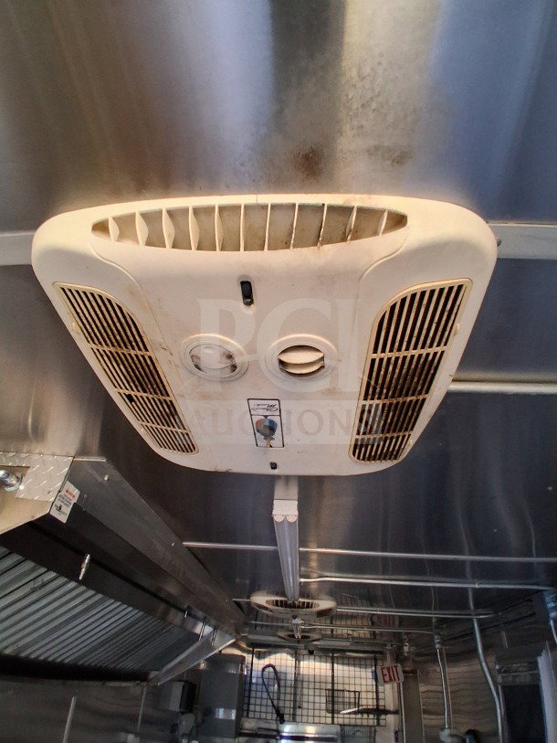 Interior of 2019 Diamond Cargo 24' mobile kitchen showcasing HVAC vents, ventilation system, metal finish needing deep cleaning.