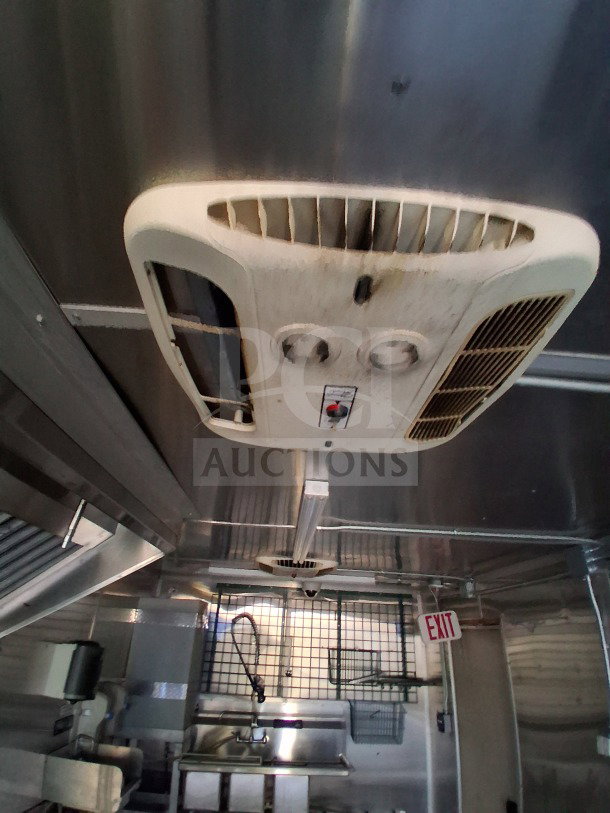 2019 Diamond Cargo 24' mobile kitchen interior with ventilation system, sinks, and wiring. Needs deep cleaning.