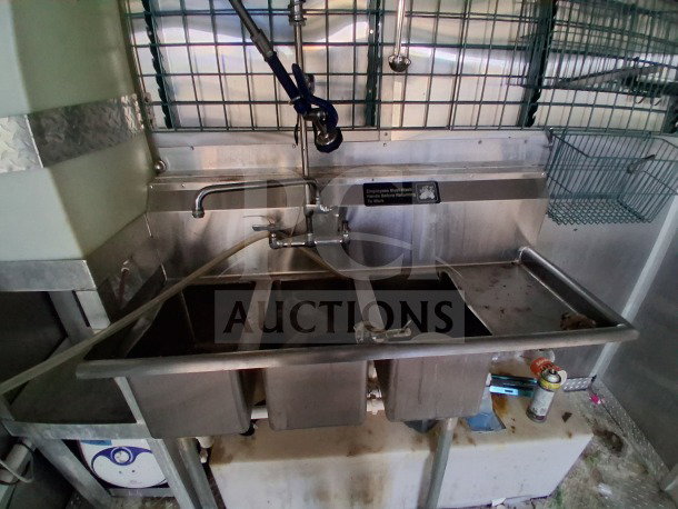 2019 Diamond Cargo mobile kitchen with 3-compartment sink, ventilation, plumbing, and shelving, needs deep cleaning.